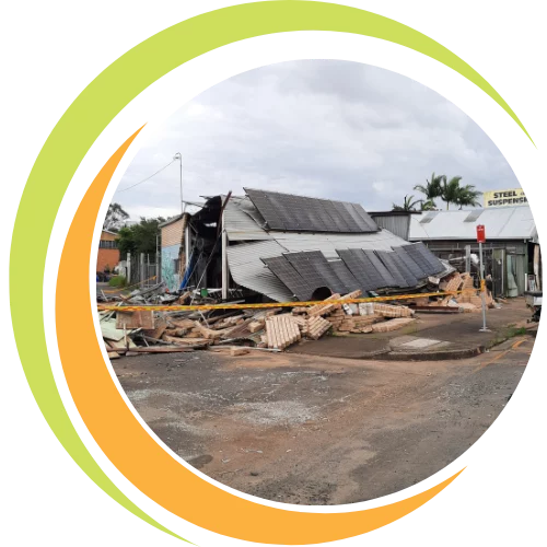 Small business owner reviewing a disaster recovery plan with backup files, emergency checklists, and a laptop to ensure business continuity after unexpected events.