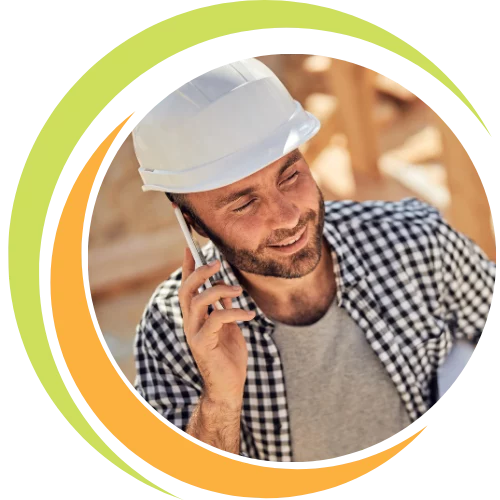 Entrepreneur planning a scalable startup with a low budget, using a laptop and notes to build a profitable business for under ten thousand dollars.