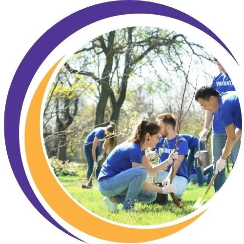 Group of volunteers planting trees in a park, representing teamwork, environmental care, and community action.