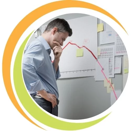 Business leader guiding a team through organisational change, analysing strategies to overcome resistance and create lasting transformation success.