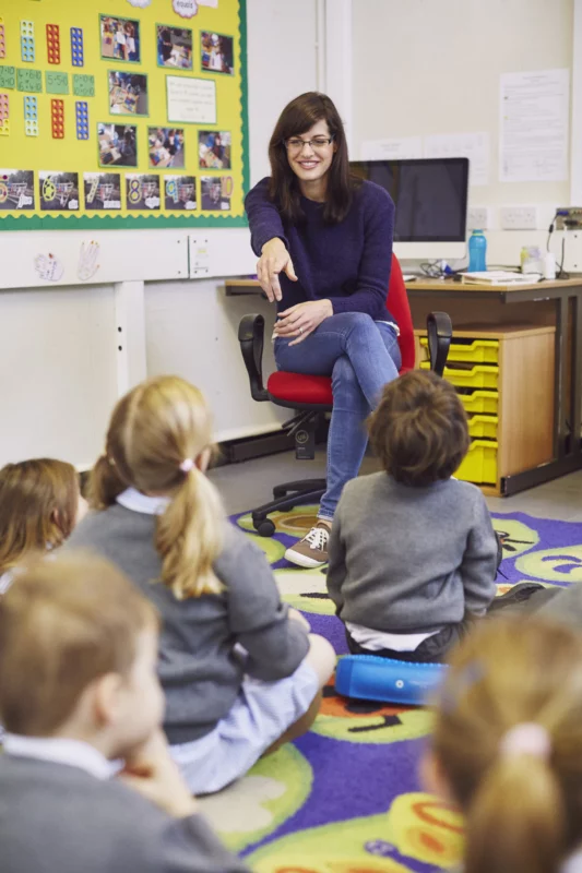 Teacher interacting with students on colorful clas 2026 03 25 07 26 53 utc