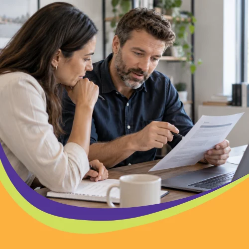 Small business team discussing AI risks in a printed policy document