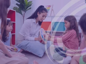 An early childhood educator working with young children in a centre.